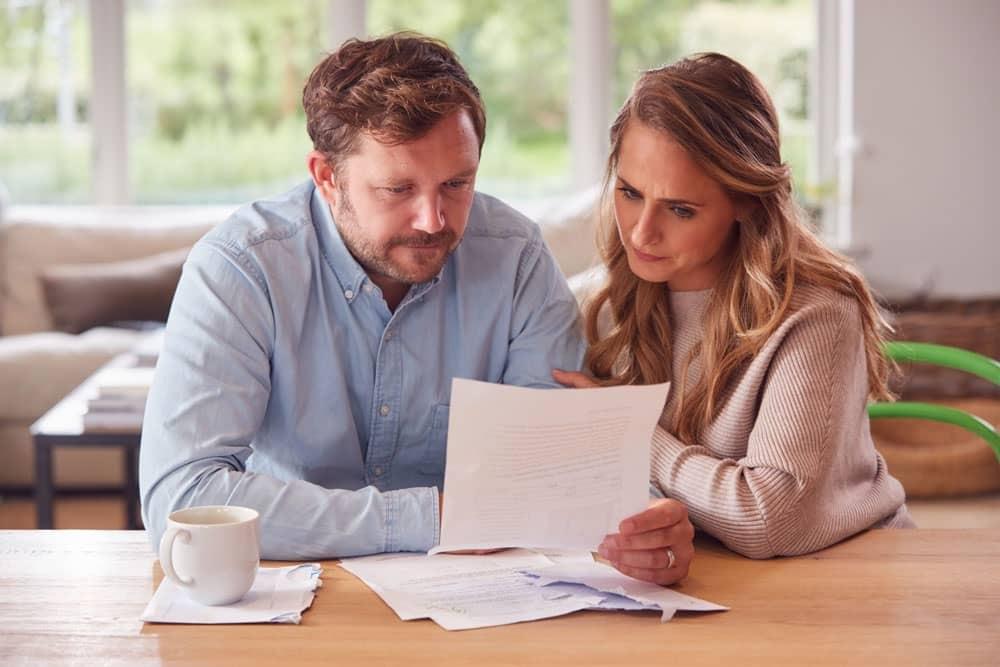 couple reviewing documents at table